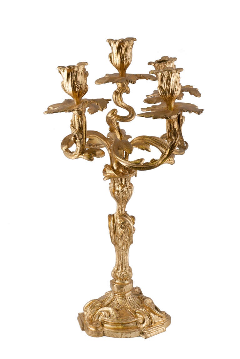 These are an ornate pair of five branch Rococo style gilt bronze French candelabra. They detach in two halves and the bobeches unscrew as well. They are marked 'Made in France' on the base. We date these to circa 1900.
Note: We have a pair of