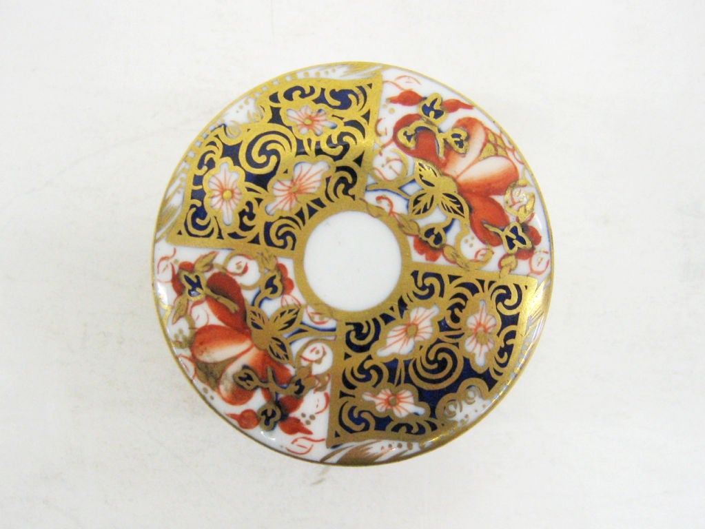 A richly hand painted Porcelain small circular box from this famous English firm.  The pattern is 'Imari' 2451.