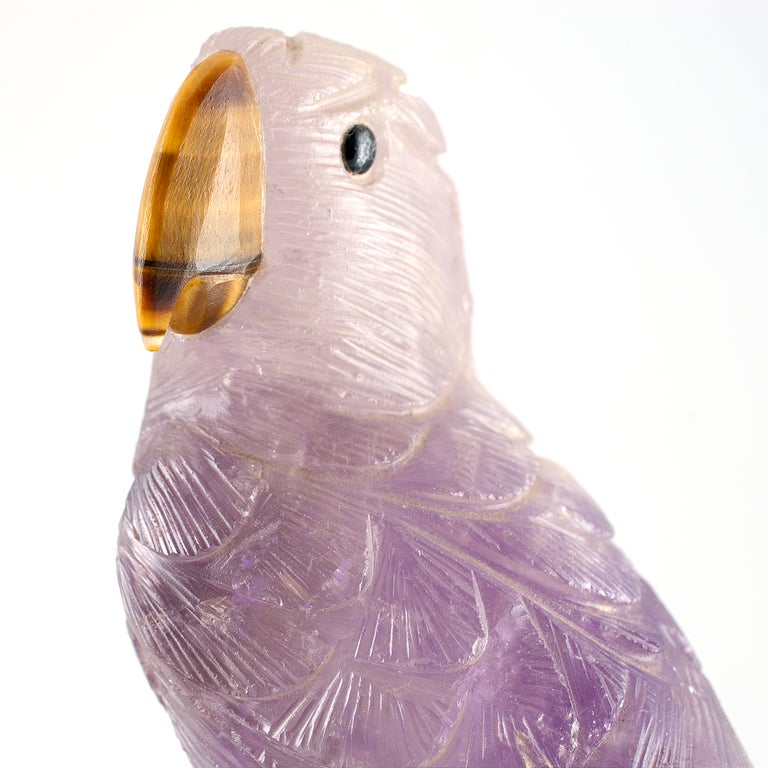 Amethyst carved parrot with silver claws and tiger's-eye beak. 1
