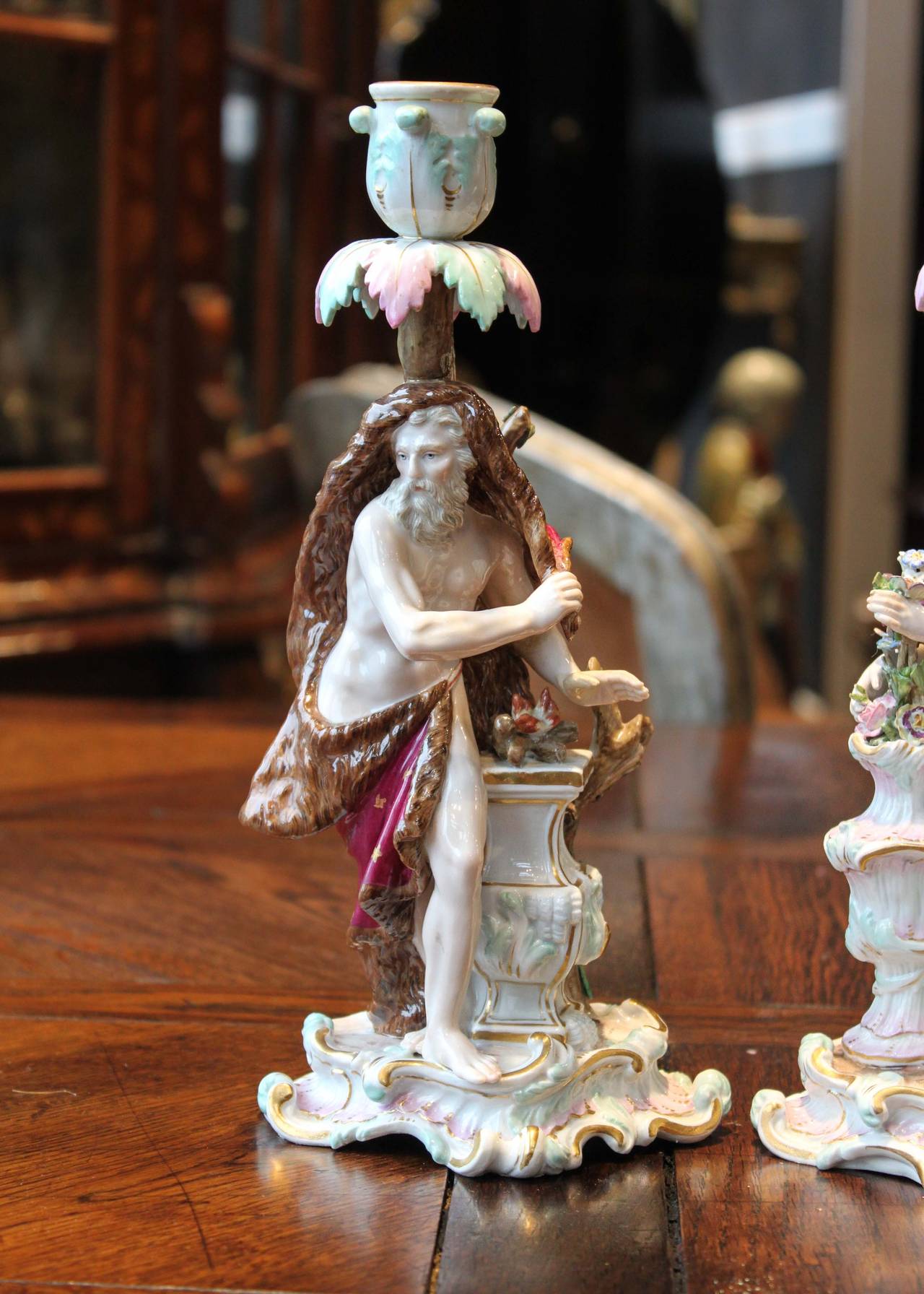 Pair of 19th Century figural porcelain candlesticks by German maker Meissen. Restoration noted, in wonderful condition.

5