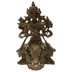 Seated Sino-Tibetan bronze on lotus with Budhistic symbols