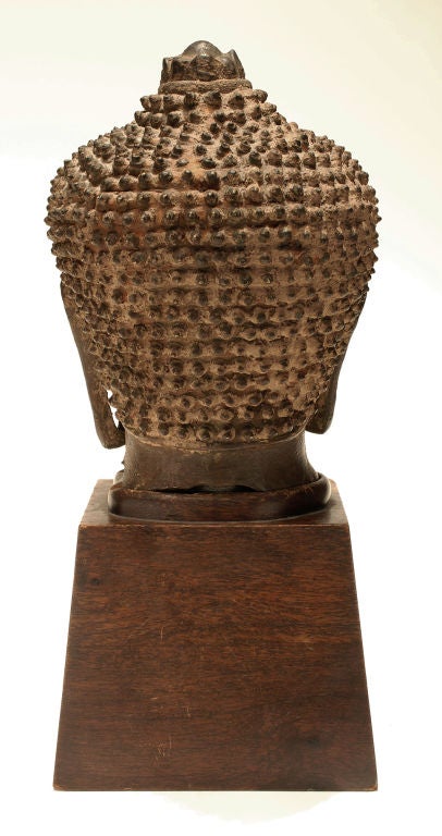 18th Century and Earlier Asian bronze Buddha head on wooden stand