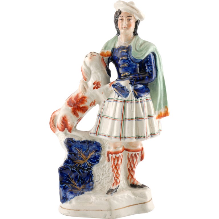 Staffordshire figure in kilt with dog For Sale