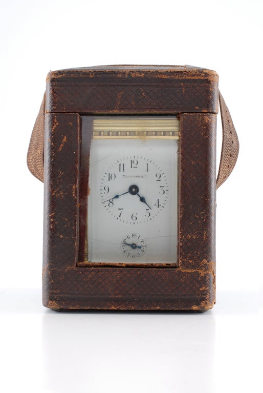 Tiffant carriage-clock in original chagrine case and with alarm and two dials on face.