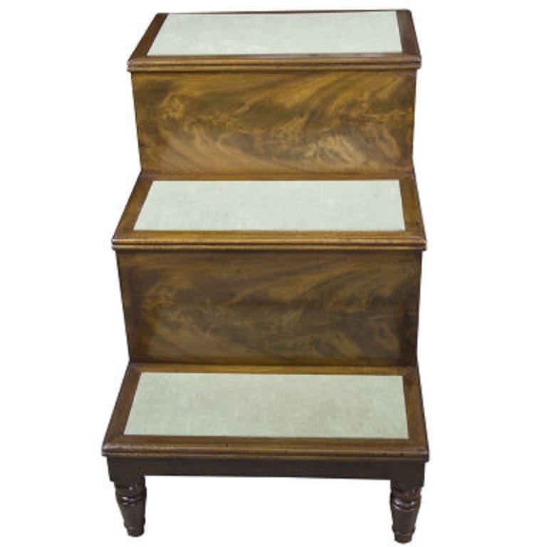19th century mahogany bed-steps. Great side table for living-room or bedroom, as a side table for lamp and books. Concealed storage compartment.

Materials / Techniques: Mahogany and velvet. With stoMahogany bedsteps, 19th century, England.

