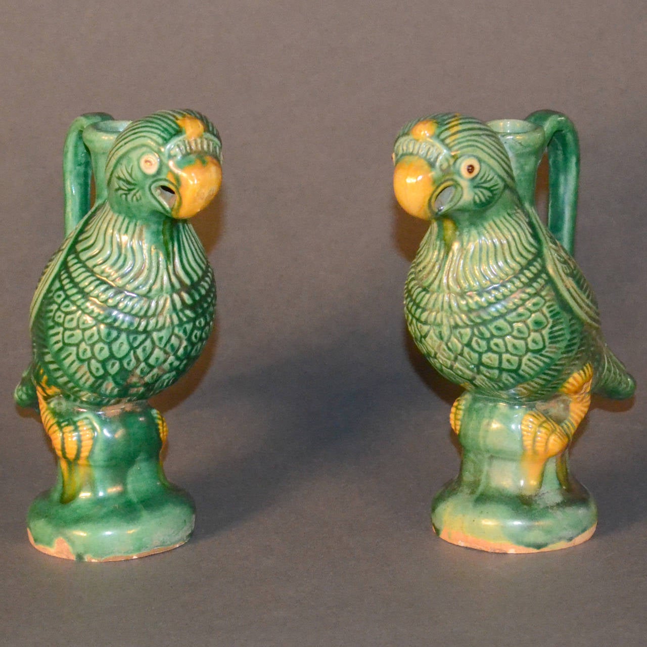 Pair of green and yellow glaze on buff pottery. Tang style candleholder pitchers.
