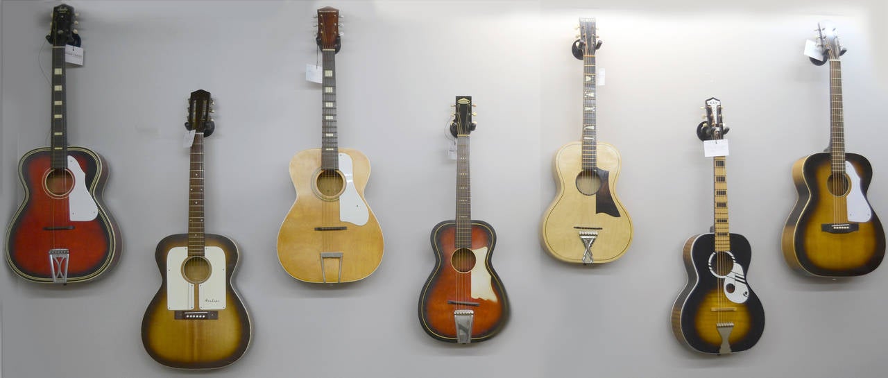 Set of seven vintage guitars from the 1950s-1960s with wall hangers. All guitars are in good working and playing condition and sound great. But make a very cool art statement as a collection of wall hangings. Set comes with wall hangers.