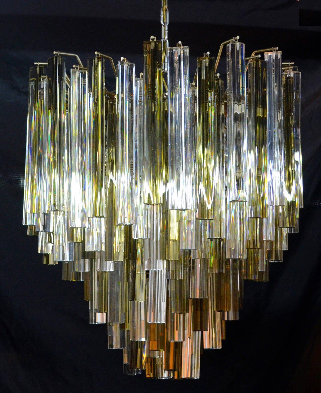 Large 1960s Italian chandelier by Camer (signed) with Murano glass prisms in both smoke and clear.  Chrome frame in tiers.  Outanding design with staggered levels.