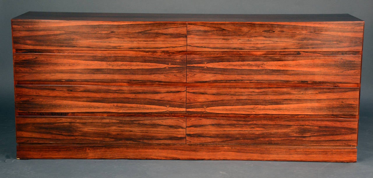 Beautiful Rosewood grain.  6 drawers, solid piece with modern styling.