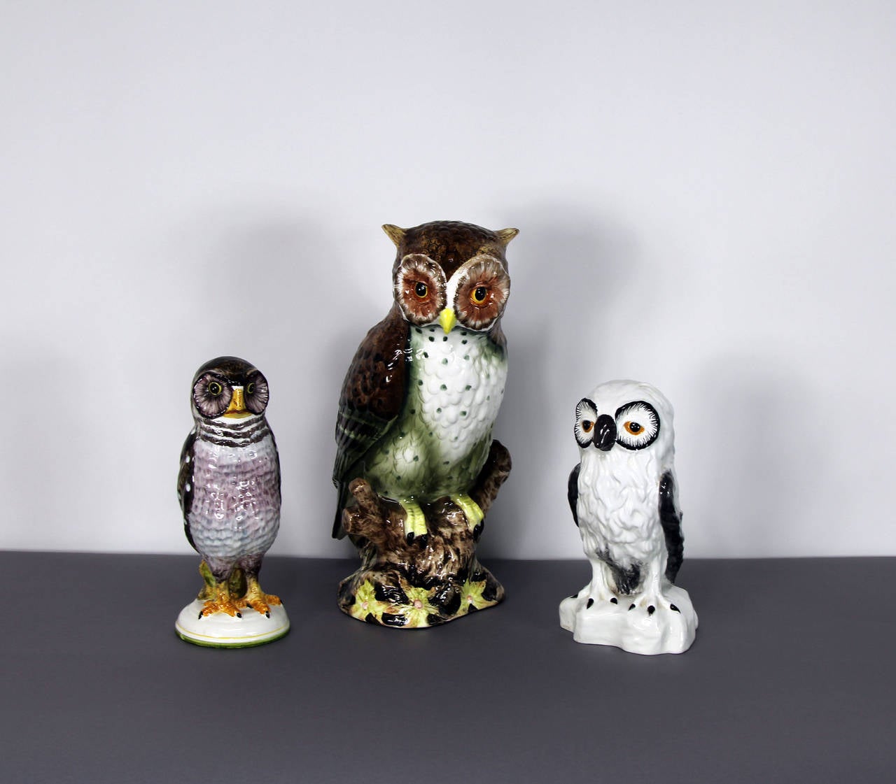 Three vintage hand-painted ceramic owls made in Italy in the 1970s, the two small owls are marked Meiselman, the large owl is not signed.

Large Owl: 15 inches high, 8 inches wide and 9 inches deep.
Small White Owl: 9 ½ inches high, 5 ¼ inches