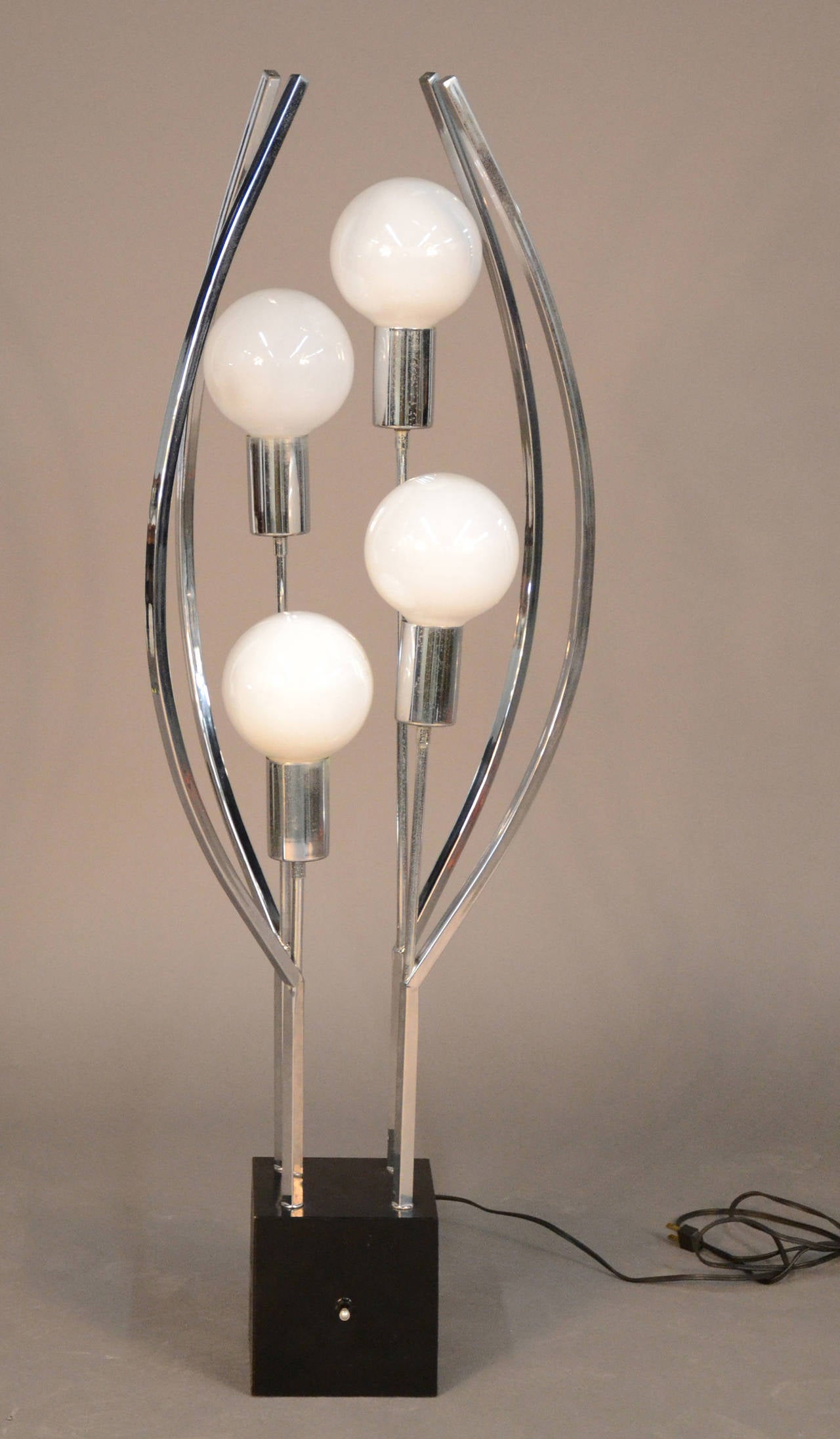 Very unique chrome sculptural lamp. Four lights on block base in the manner of Sonneman.