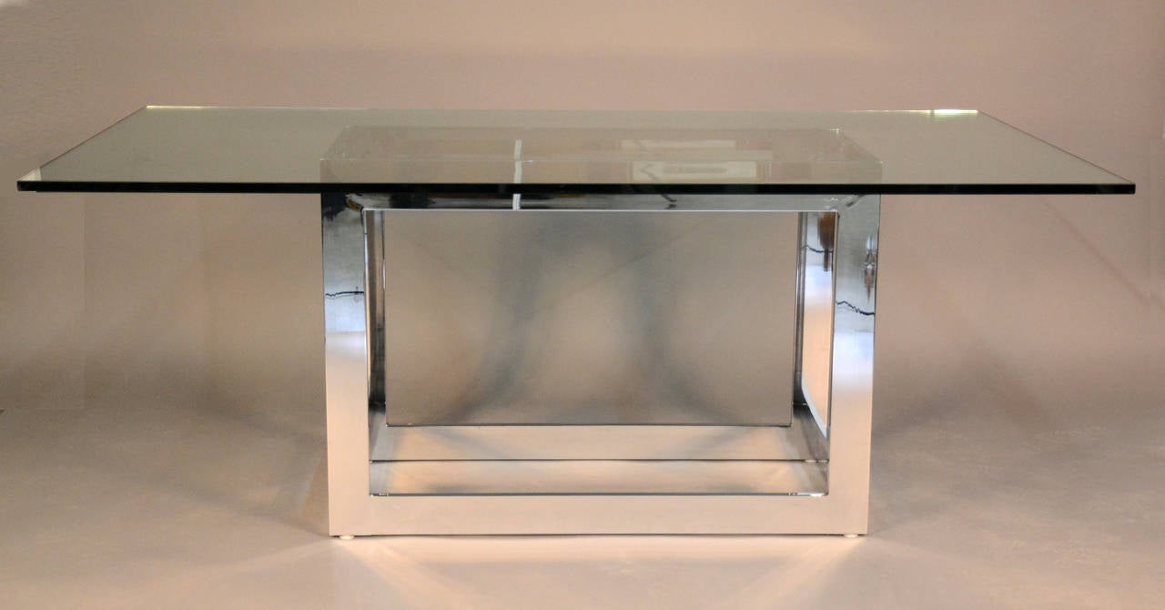 Chunky chrome base cubic dining table with thick 3/4 inch glass top. Beautiful modern style.