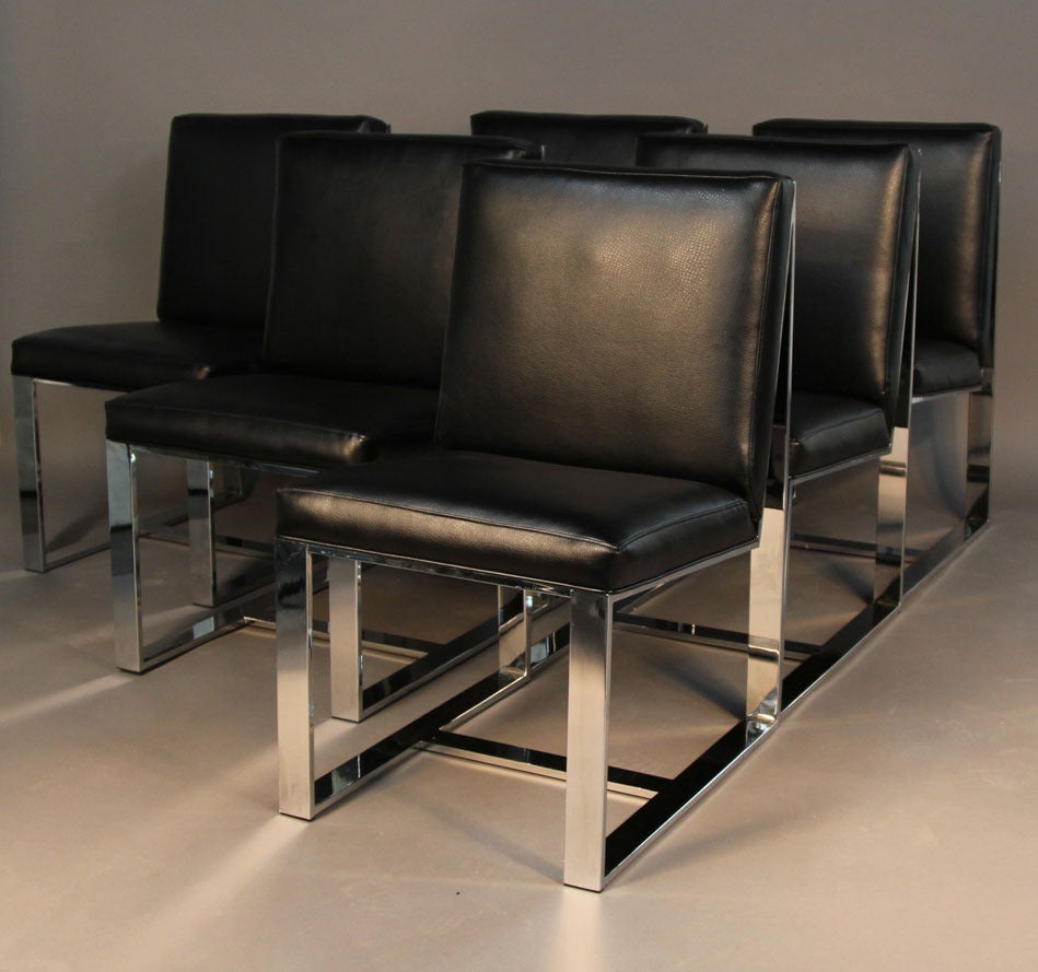 Set of six heavy flat bar chrome dining chairs from Milo Baughman. New upholstered in black vinyl with great texture. Looks like beautiful leather, but much more durable. Chrome is in great condition.