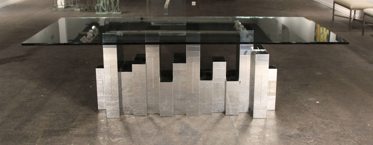 Unbelievable Paul Evans dining table with gorgeous chrome in geometric Mondrian style shapes pieced together to form the iconic cityscape table. Very thick and very heavy glass sits atop this table and would make a statement in any home. Would also