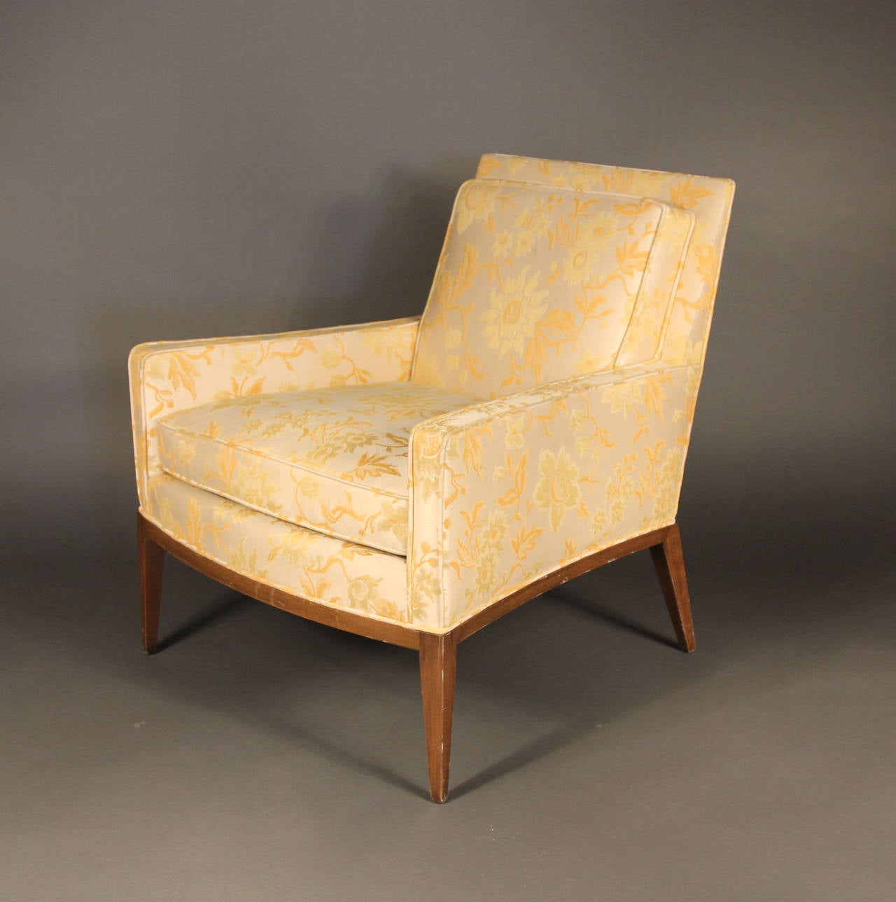 Gorgeous lines and tapered legs on this Harvey Probber upholstered club chair. With original fabric in pristine condition with Harvey Probber labels. Tapered wood legs.