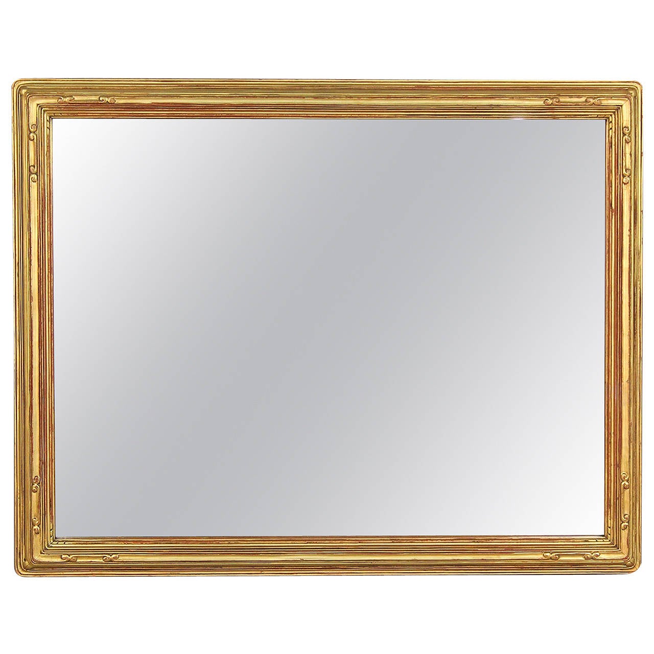 Large and impressive late nouveau style gilt mirror with elegant detail.