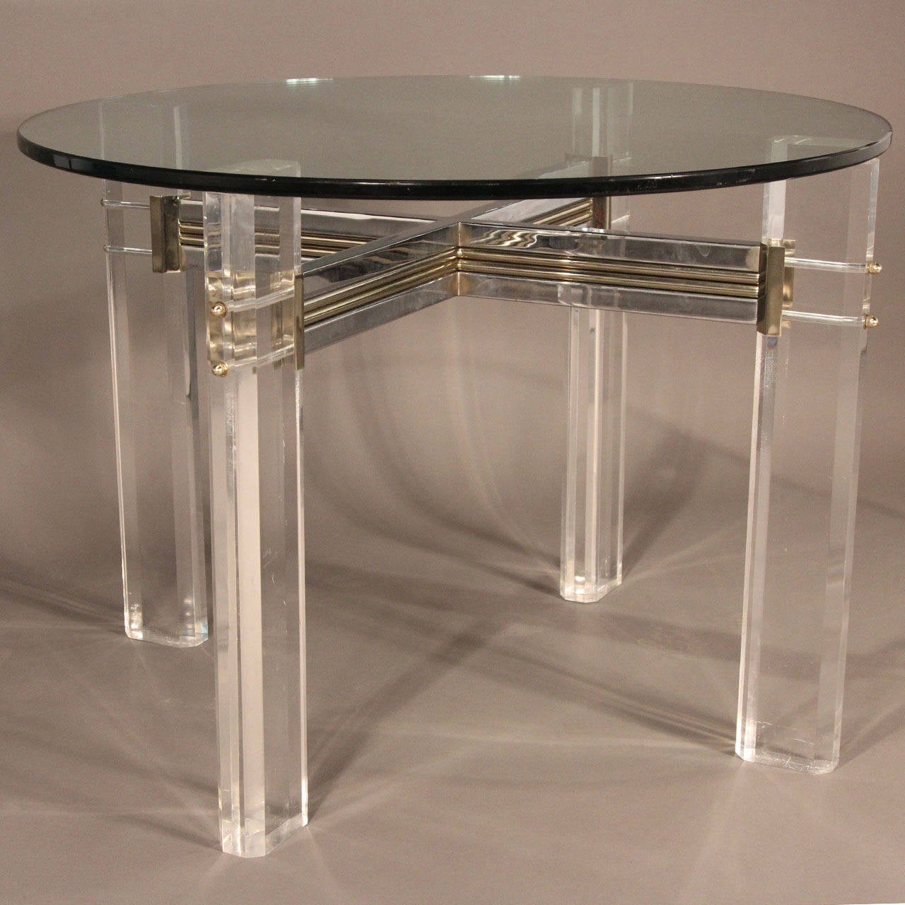 Gorgeous, very unique, Lucite dining table base with chrome and brass crossing hardware. Shown with 1 inch glass top. Can hold up to 60