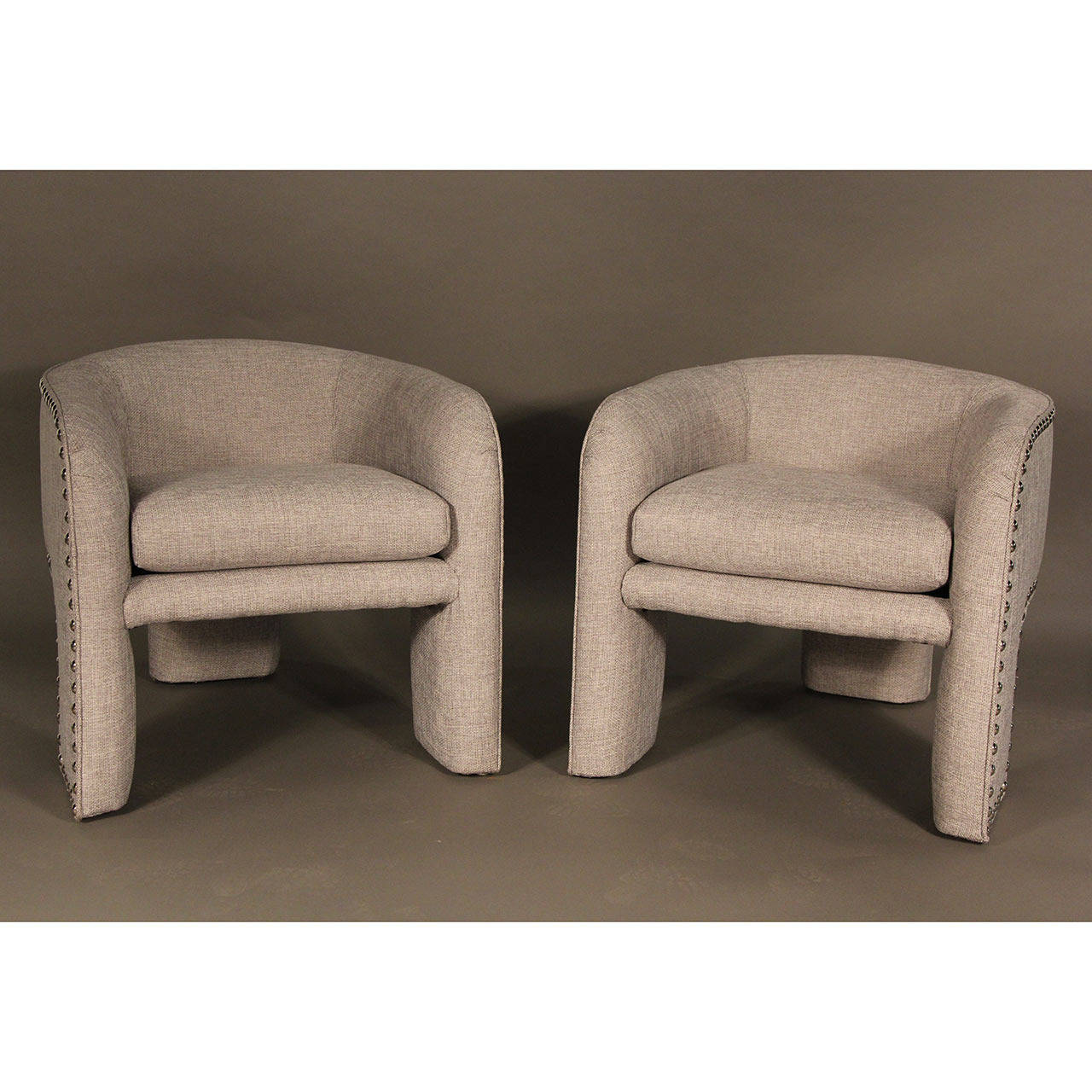 Done in silver and white cotton blend fabric, large nickel nailheads from the 1980s produced by Preview Furniture Slight variation in form with more curves employed as well as back cushioning. Tagged Preview.