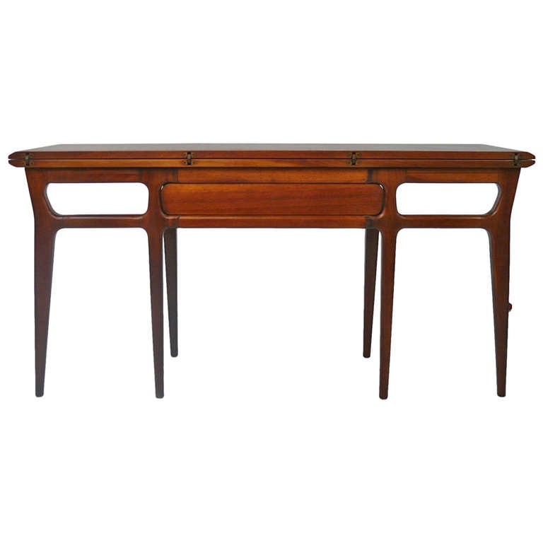 Circa 1960 Henredon Heritage in the manner of Ico Parisi. Console table easily converts to larger table for dining or workspace.There are some light scratches on console top and it is in good, as found, vintage condition.

Table Opened: 36 Deep x