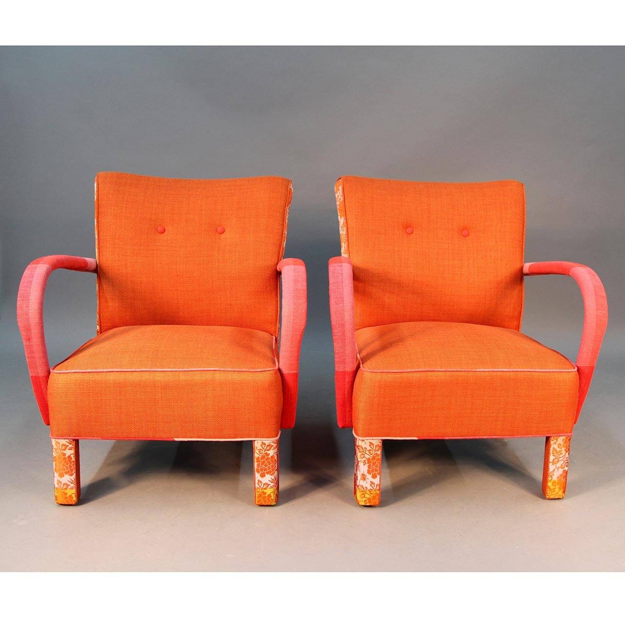 Pair of vivified Jindrich Halabala chairs done in three fabrics. Japanese silk Obi on sides of chair and front legs. Orange contemporary cotton woven fabric (China) on the body of the chair along with oversized Daniel Cooper plaid fabric on arms and