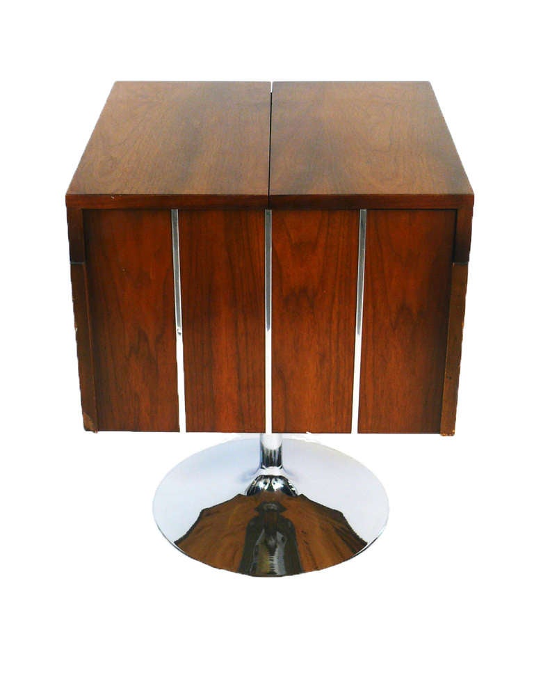 A beautiful pedestal Bar made of Walnut and Chrome by Lane. The top opens to reveal a bi-folded wing-tray and a storage with a removable bottle holder. The walnut case can be swiveled to any direction. In addition to a bar, it can be used as a side