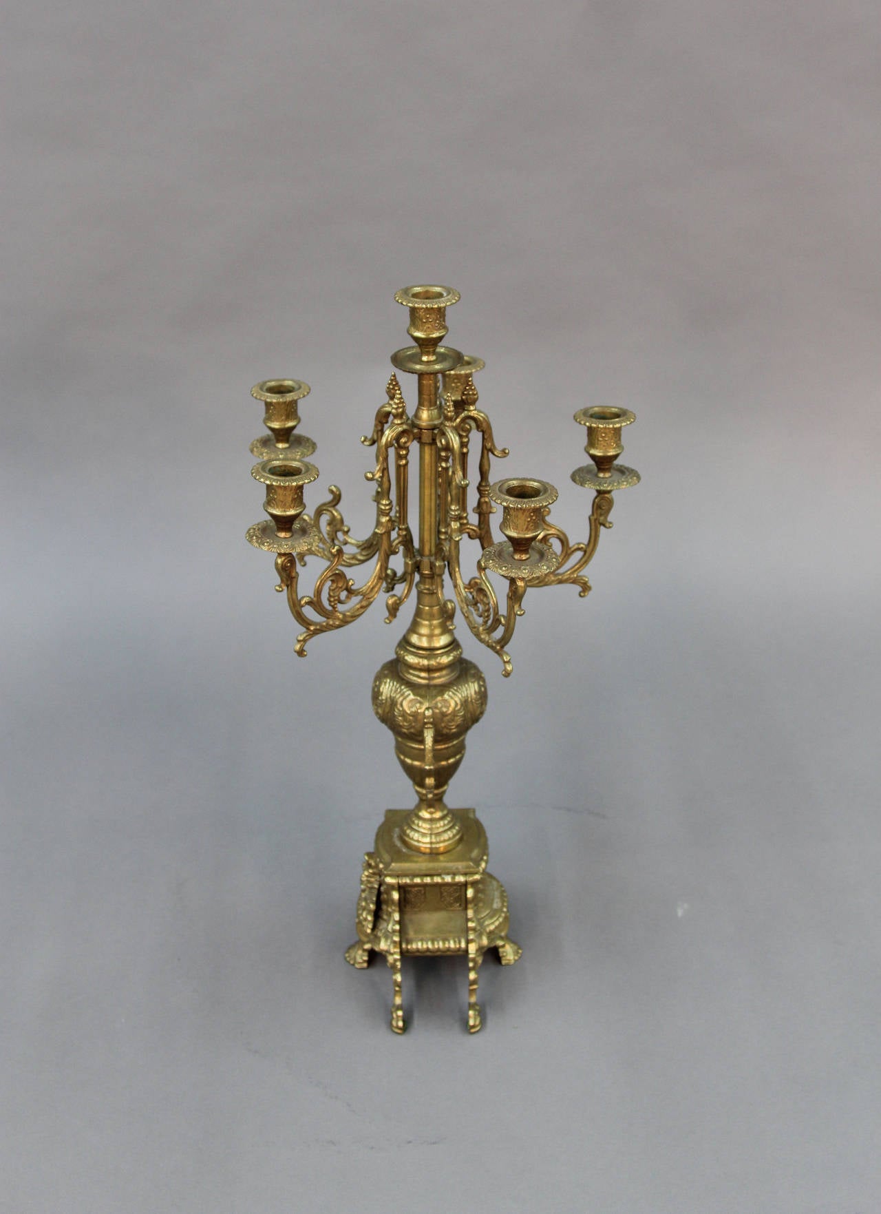 Pair of elegant neoclassical brass Brevettato candelabras, Italy, marked.