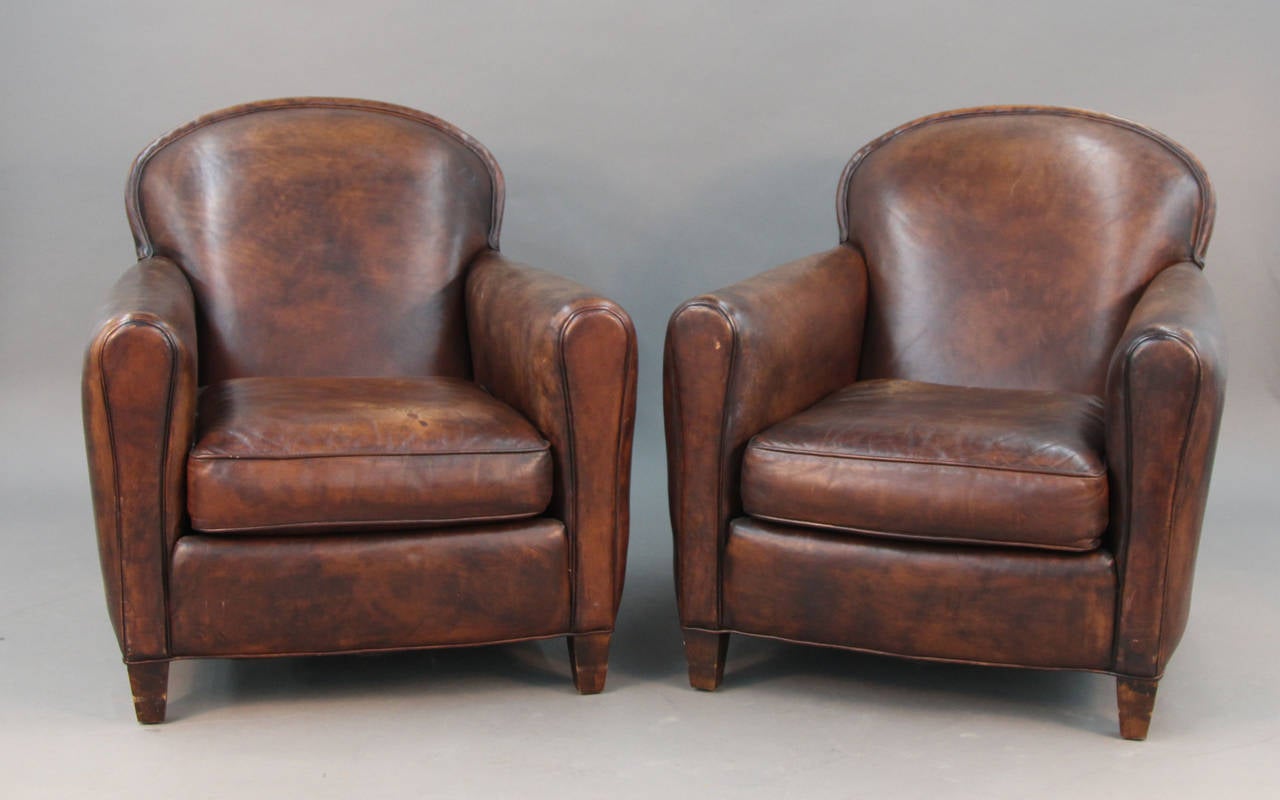 French Art Deco style leather club chairs. Great patina and aged look to the leather.
