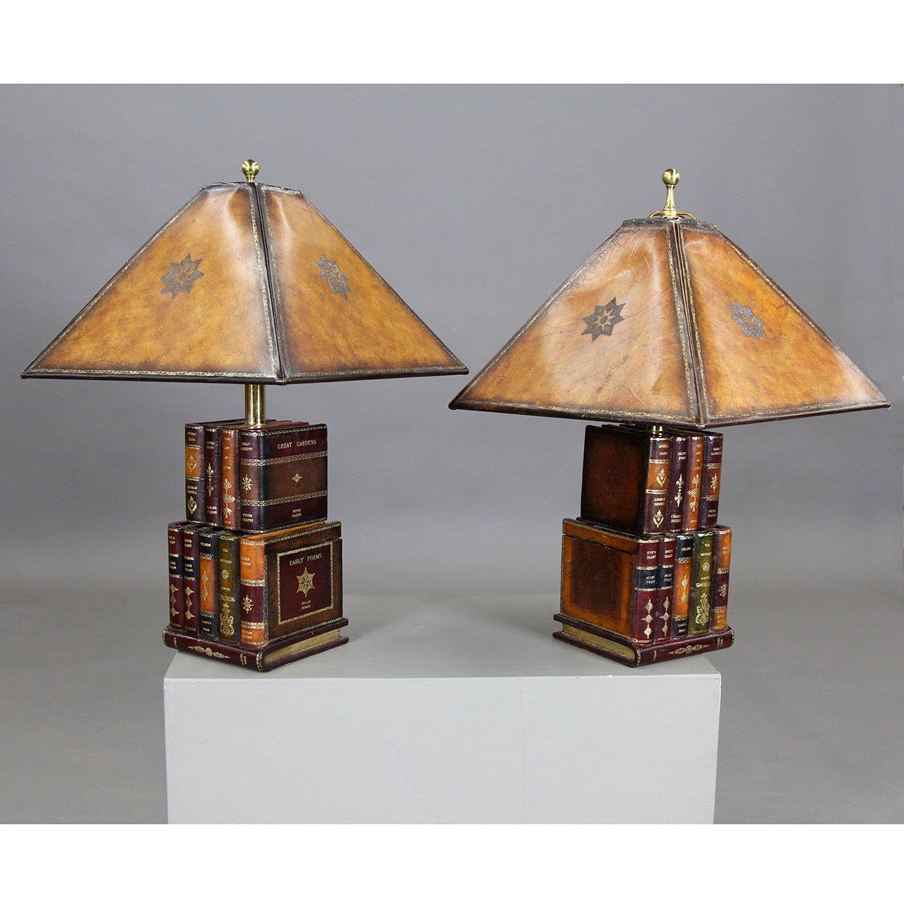 Two leather covered wooden lamps with tobacco leather shades. There are two hidden compartments on each.
