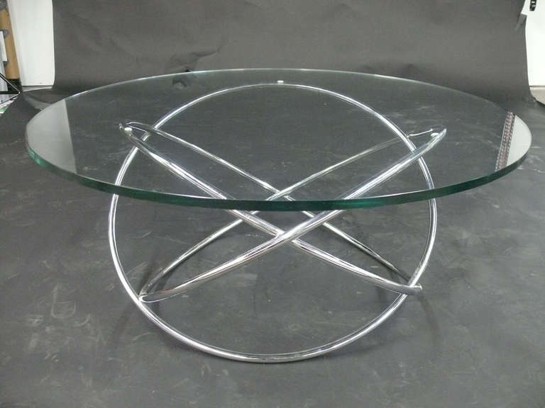 Chrome tube atomic base coffee cocktail table with 3/4 Inch glass top.