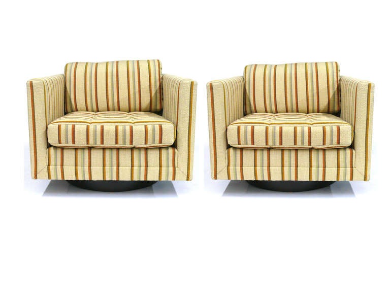Pair of Harvey Probber Swivel Cube Chairs in original vintage upholstery on round mahogany base. These chairs retain all of the original upholstery detail, as designed by Mr. Probber, including the mitred corners and tufted seat cushion.  The chairs