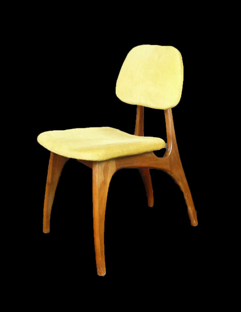 Set of four Teak Midcentury Modern style dining chairs.  Upholstered with yellow/green velvet fabric.