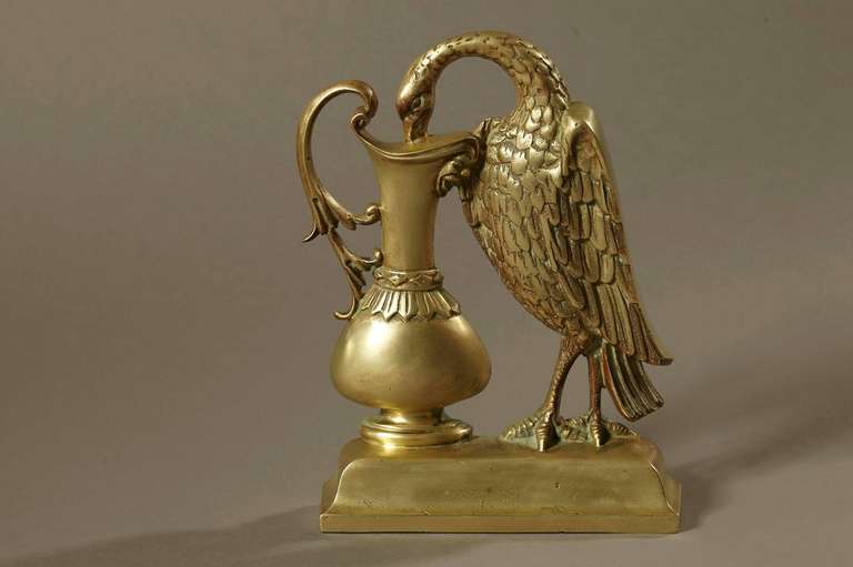 19th century brass door stop showing a very detailed mythical Ho Ho bird drinking from a goblet.
The Ho Ho bird is a mythical bird from Japan, he is a composition of several different birds.
Very nice patina. Measures: Weight 7.2 lbs.