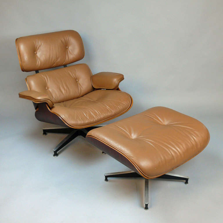 Early 1970’s Eames 670 and 671 lounge and ottoman in rosewood and sienna brown. Made by Herman Miller with labels intact. First chair that Eames designed for the high-end market. Chair is in the permanent collection of New York’s Museum of Modern