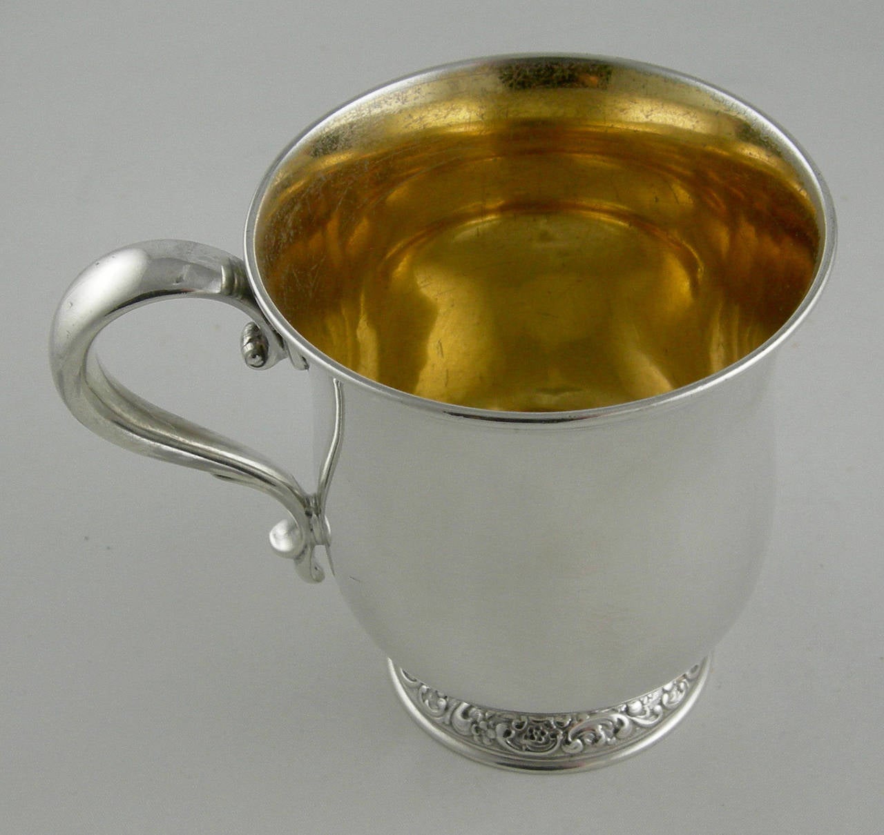 Tiffany & Co. Sterling baby cup
Makers serial date 13256 (1897).

Vermeil (gold wash) inside.
No monogram.

Dimensions: Weight: 5.025 Troy ounces.