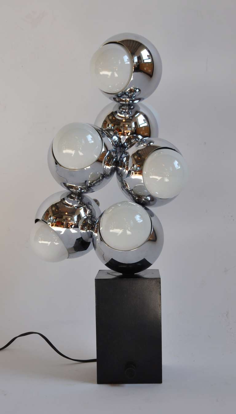 Pair of atomic form table lamps in chrome and lacquered metal.