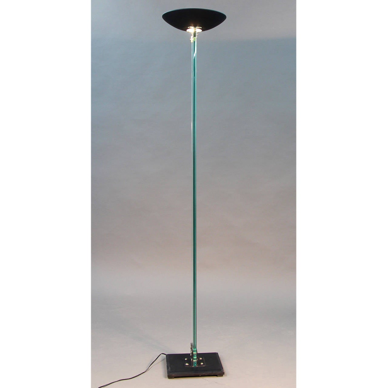 Gorgeous, superb quality glass column floor lamp/torchiere with polished brass and black enameled metal accents. Dimmable.