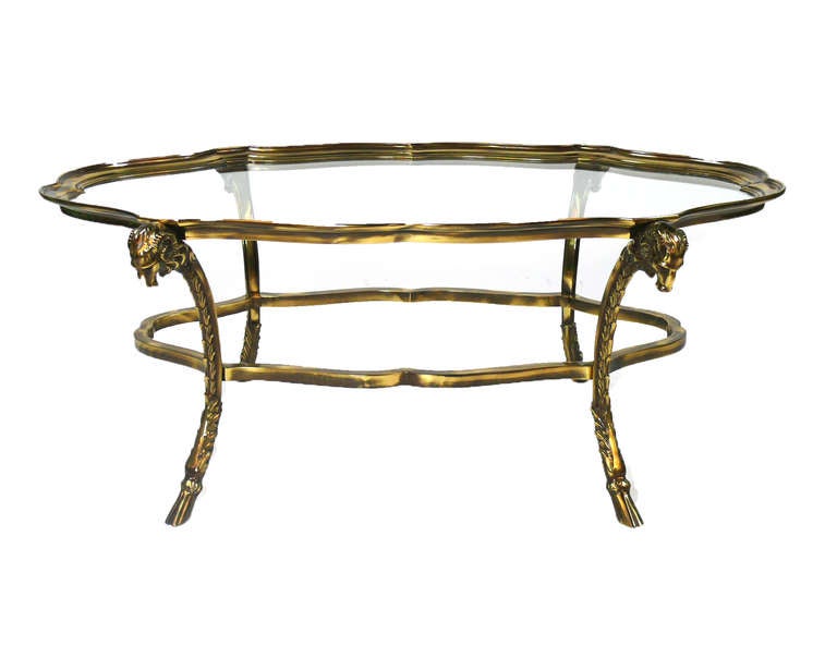 Stunning Solid Brass Sculptural Rams Head Coffee Table in Maison Charles Style . Exquisite detailing includes scalloped edge border and table feet complete with decorative ram hoove.