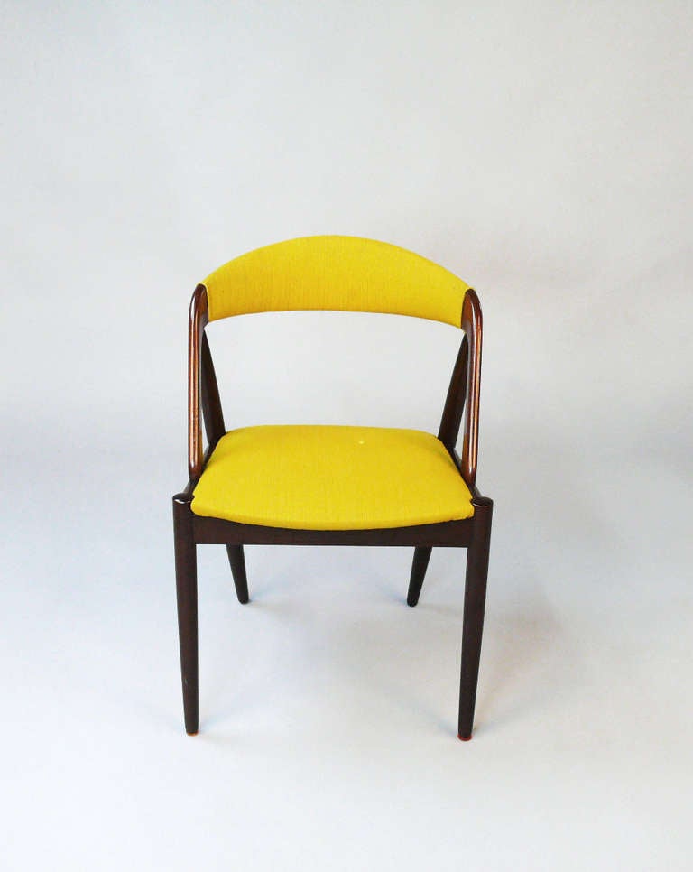 Some of the most classic and beatiful dining chairs to come out of the 1950's with it's A-frame and curved back. The fabric has no tears or rip but has stains from age wear and the chairs would beenfit from being reupholstered.