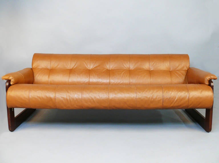 Rosewood frame with vintage camel color leather Percival Lafer couch.  Clean mid-century lines and modern design.  Frame is in great shape, there are a couple tears to the leather seat that have been glued, but not done perfectly.  The leather could