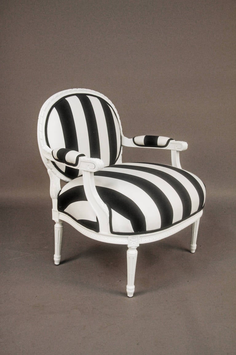 Pair of newly upholstered Hollywood Regency chairs.  Black and White Striped Polished Cotton Fabric with new lacquered frame.
