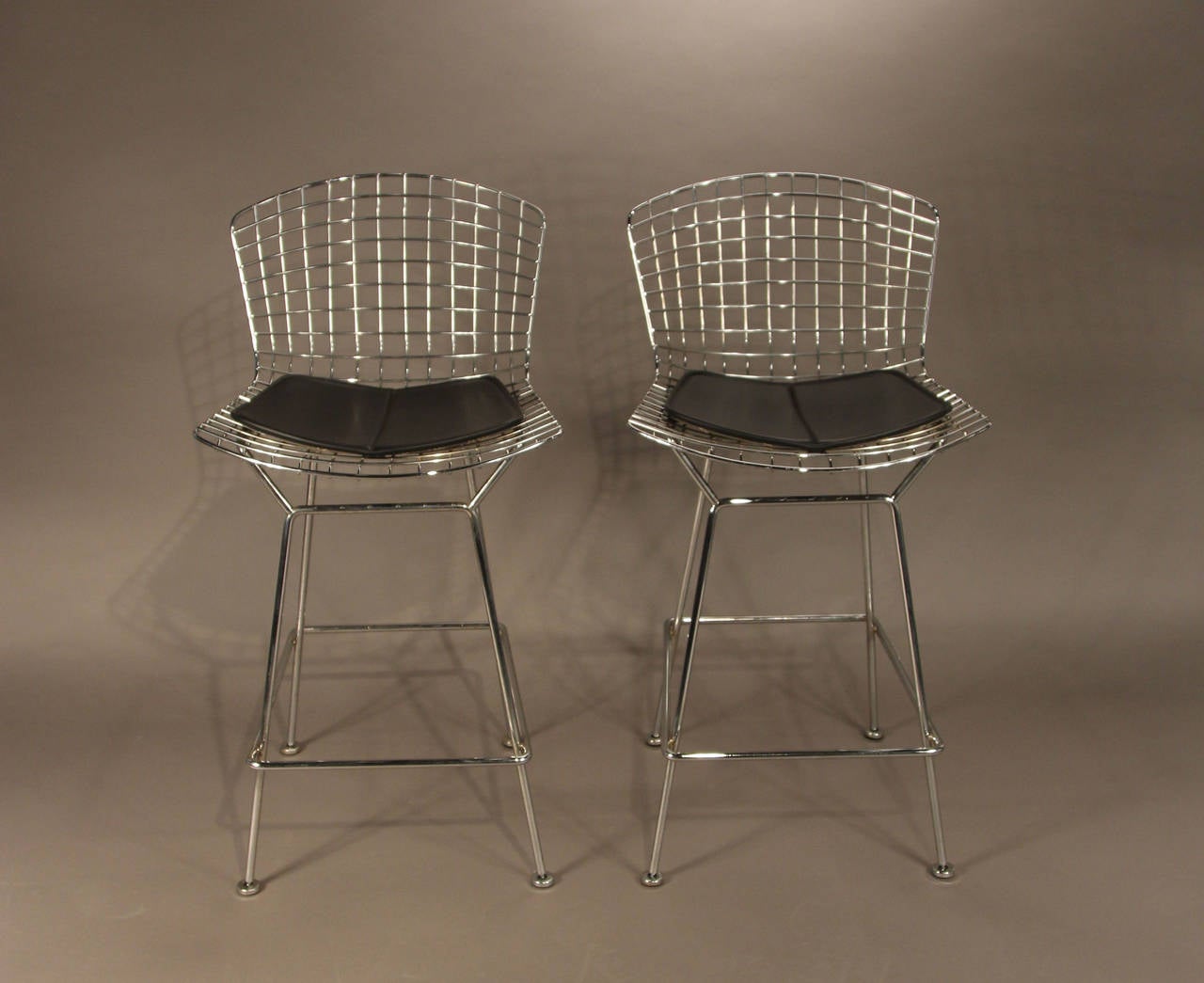 Designed by Harry Bertoia, licensed and produced by Knoll.  With black leather seat pads.  Knoll signed.