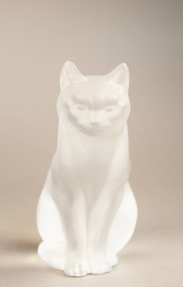 Signed Lalique costal cats.  One in upright sitting position and the other in lay down stalk position.