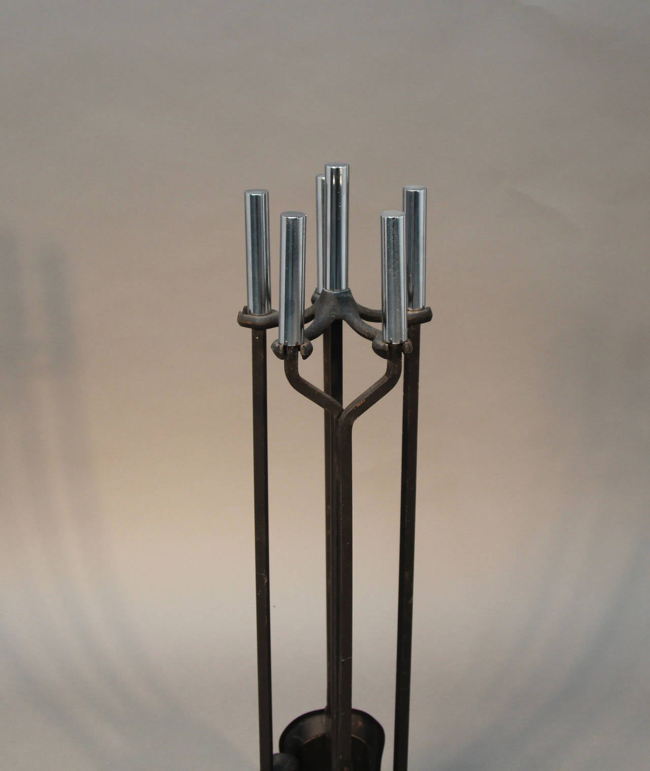Set of chrome handled modern fireplace tools. Iron with polished chrome handles.