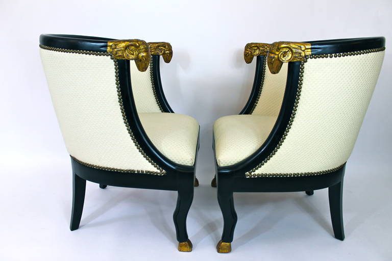 Pair of Carved Rams Head Chairs with Stunning Gilt Detail.  Ebonized frames and nail head trim.