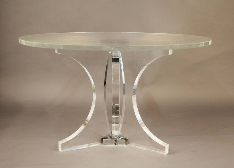 Three inch thick lucite base with chrome accents.  Two Inch thick lucite top, newly polished.  Very unique piece, very heavy solid vintage lucite.