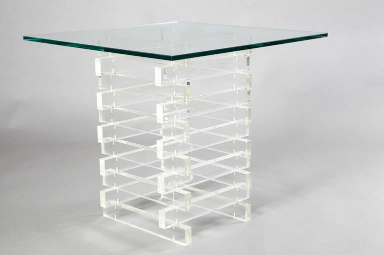 Beautiful stacked Lucite side table with thick rods and glass top. Very solid construction with Lucite dowels. Lucite base 14” x 14”.