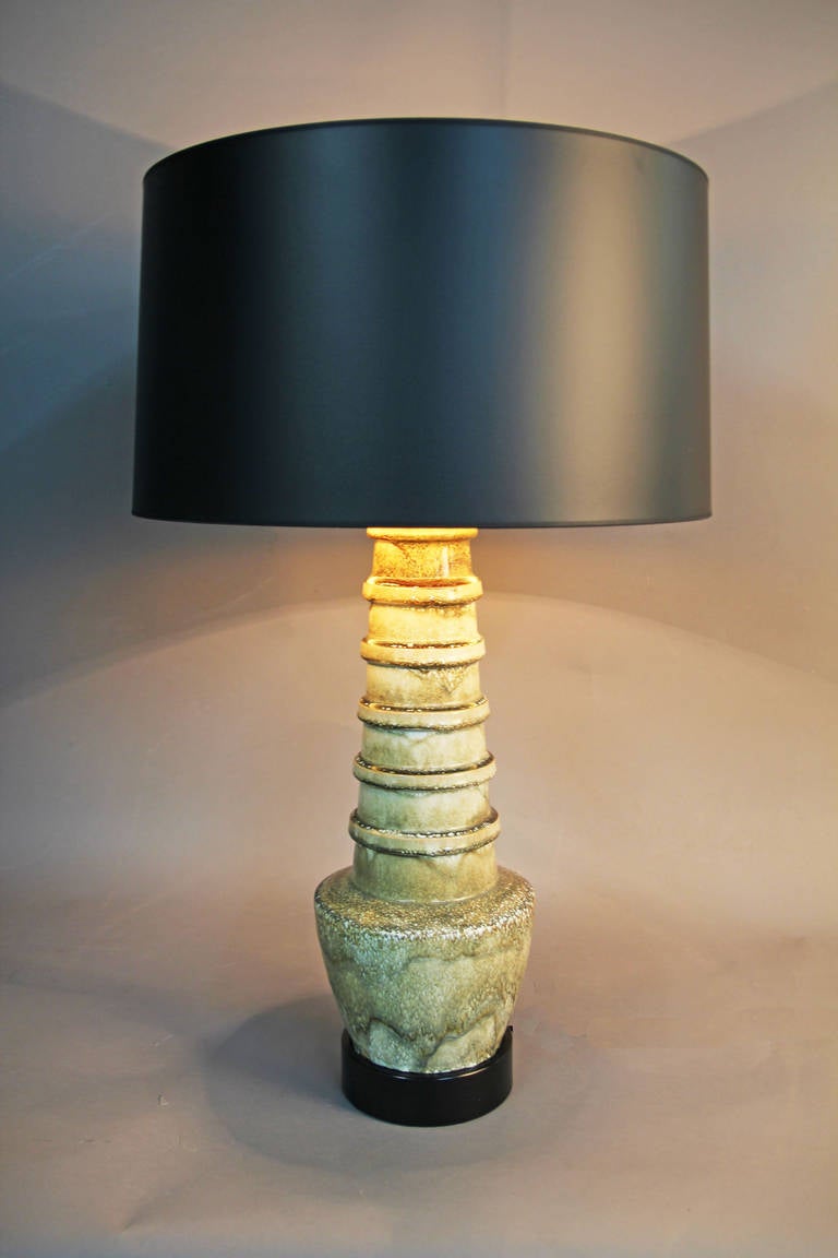 Pair of large scale ceramic lamps.  Beautiful texture and color.  No makers mark, but reminiscent of Italian ceramic production of the 1950s and 1960s.  New shades with original finials.