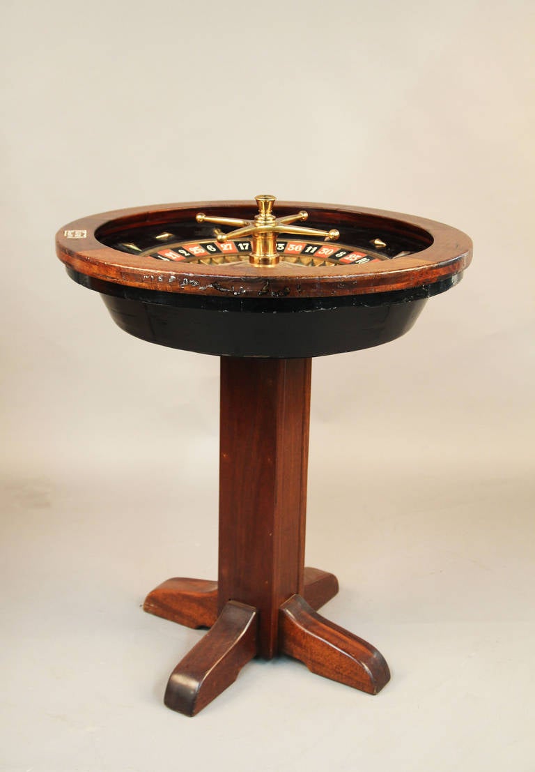 This is an authentic Monte Carlo vintage roulette wheel.  Differentiated from American wheels which include double zero.  Numbers are inlaid ivory set in stained hardwood and ebonized wood.  Brass wheel, markers and surrounding inlays.  Very heavy,