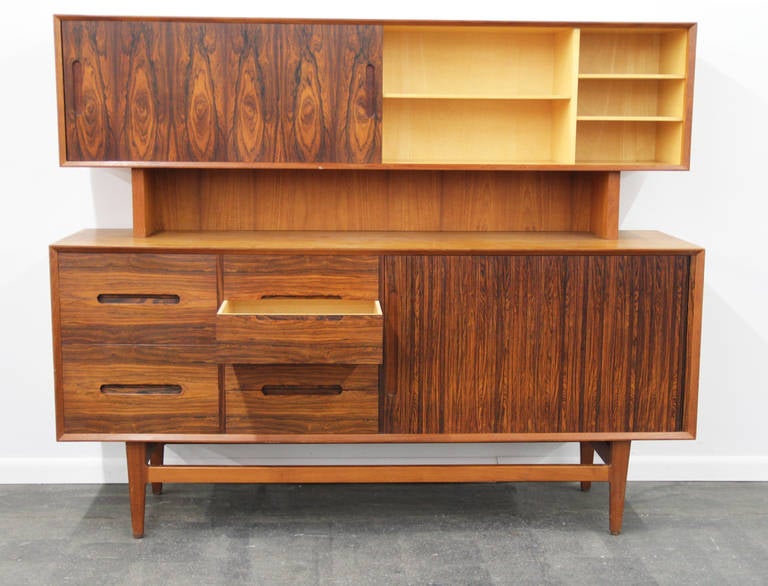 This is a gorgeous and very unique mixed use Buffet with Hutch or sideboard.  Sliding hutch door shows avocado interior.  Drawers on bottom buffet piece and Tambour door.  Rosewood front with teak and tray inserts.