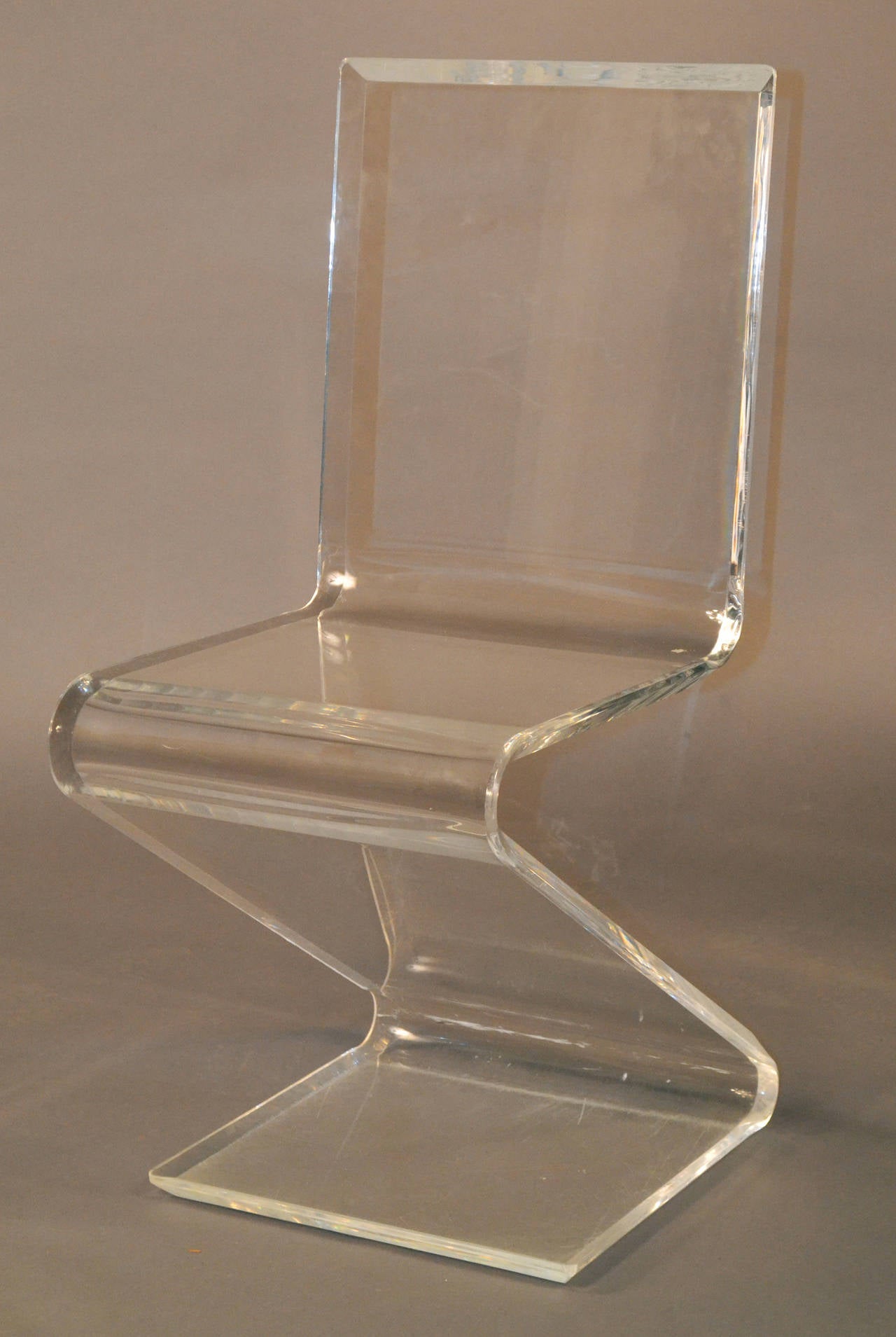 This is an amazing set.  Very rare lucite Z chairs from the 60s in crystal clear condition.  Very heavy, thick lucite.
